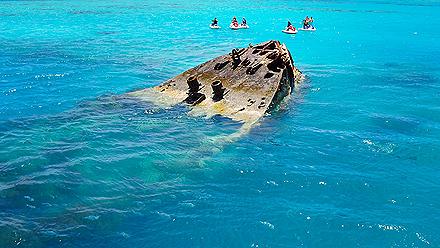 Group Jet Skiing near a Shipwreck in the Clear Turquoise Waters, Bermuda